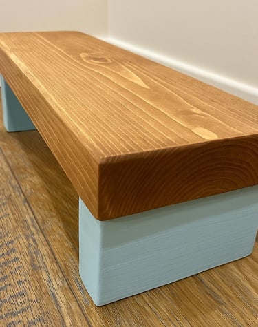 a wooden step stool with a wooden  top