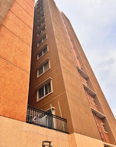 Wide shot of a residential apartment with pigeon nets fitted in Hebbal.