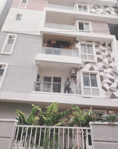 Close-up of a securely installed pigeon net on an apartment duct in Adyar.