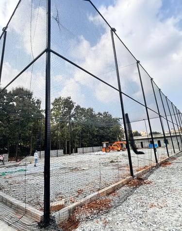Close-up of sturdy volleyball nets stretched tightly over a terrace sports area.