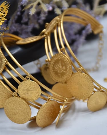 a gold bracelet bracelets with a gold coin | Alkanz Alasifar | Antalya Jewellery