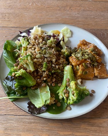 a plate of food with a salad and a fork