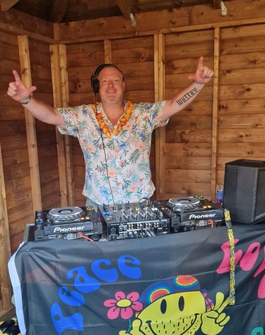 a dj in a hawaiian outfit