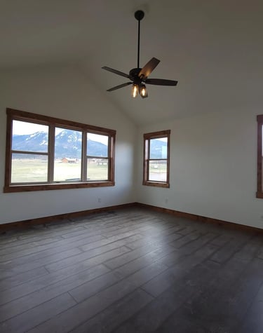 a room with a ceiling fan and a ceiling fan