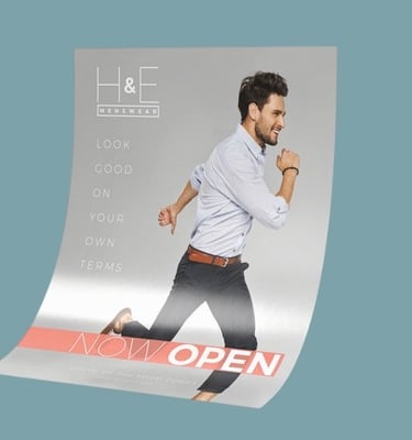 Large Format printing that have a guy running that said Now Open