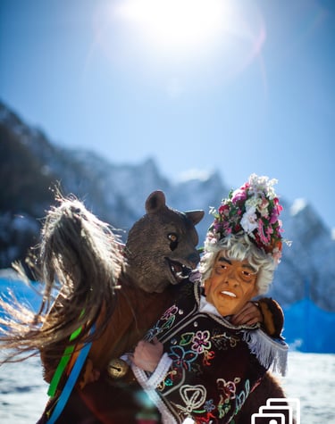 a man in a costume with a bear during carnival in winter