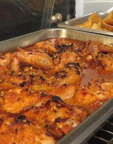 Slow roasted with chicken in a metal catering pan