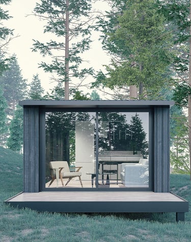 a small cabin with a glass door and a patio table