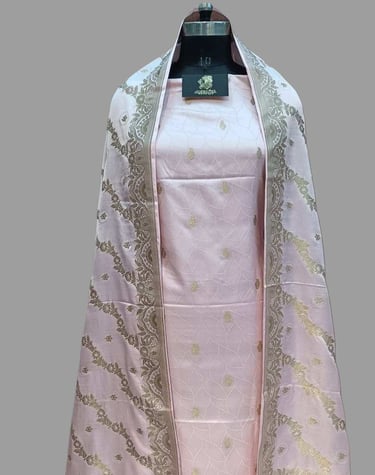 a pink and gold shawl - like shawl with a white and gold colored