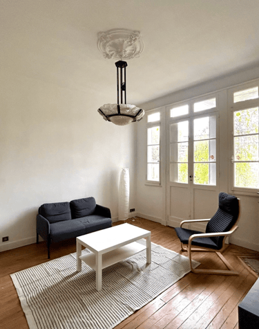 a living room with a couch and a table