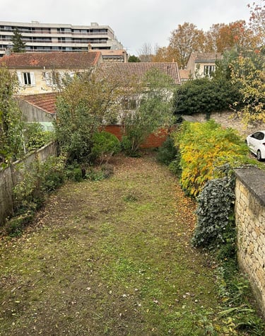 a car parked in a yard with a car parked in the driveway