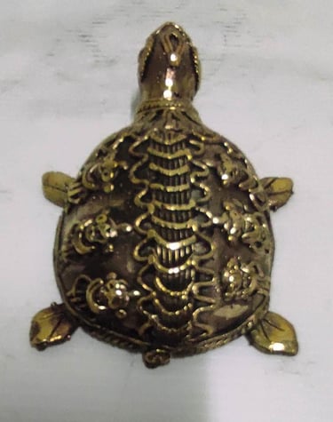 "Handcrafted brass turtle with engraved floral design–Vastu and home decor piece-Prepared for export"
