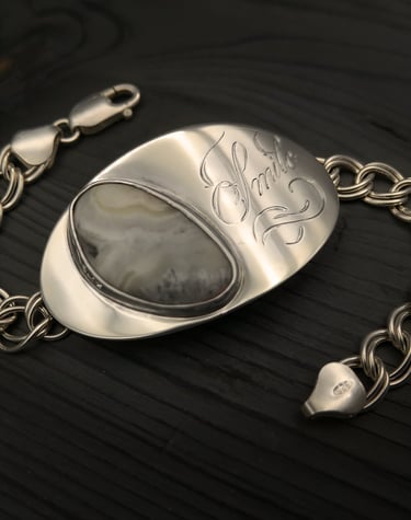 Remebering the one's we love, sterling silver bracelet ladened with sentimental meaning