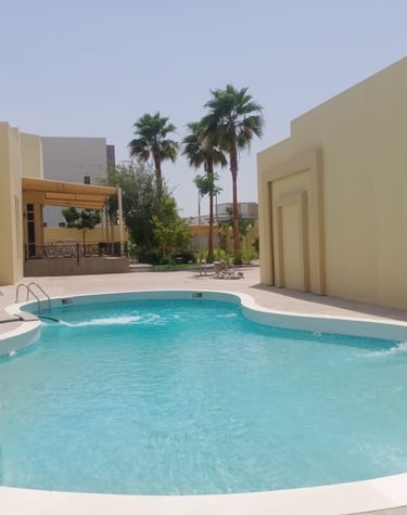 a pool with a swimming pool and a lounge area