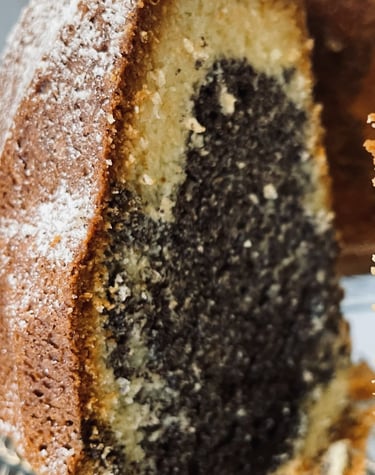 a marble cake with a slice taken out of it