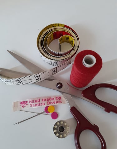 Scissors, tape measure and cotton
