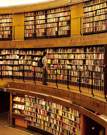 student staring the books in a university library