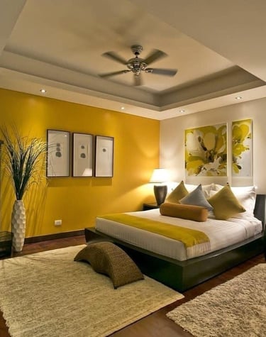 a bedroom with a bed and a ceiling fan