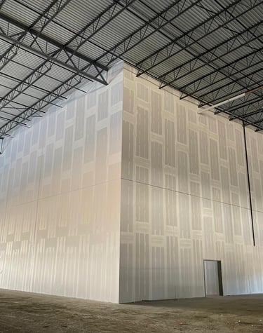 a large white industrial warehouse wall smooth finished walls