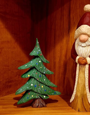 Santa in robe & xmas tree,.  Carved by James Smith
