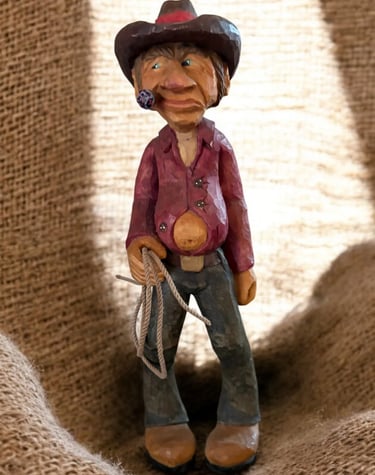 Cow Poke carved by Jim Oehmke