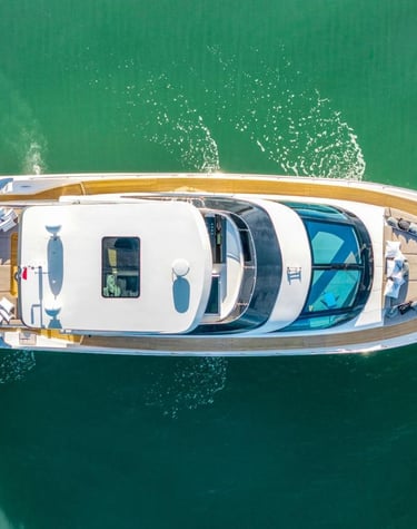 a boat with a large white boat in the water