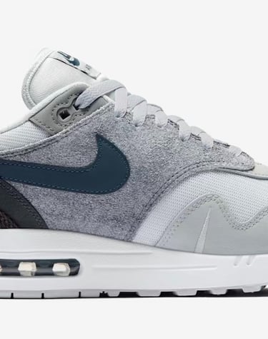 Nike Air Max 1 'London' sneaker in Urban Grey with Sail midsole, gum outsole, and deconstructed Swoosh design