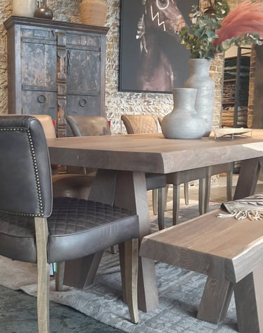 a dining room with a table and chairs