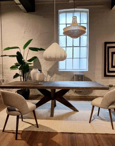 a dining room with a table and chairs