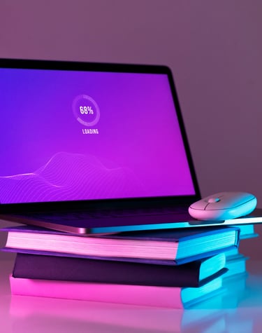 a laptop computer sitting on top of a stack of books