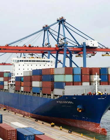 Photograph of a business meeting showcasing international collaboration around a conference table.
