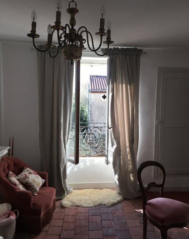 a living room with a chandelier and a chandelier