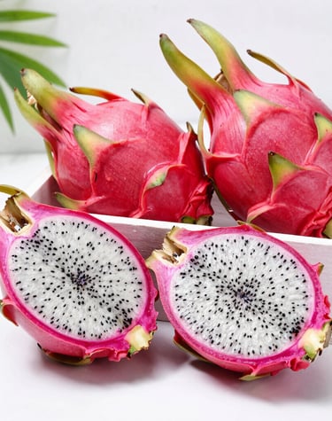 Close-up of vibrant red and white dragon fruits freshly harvested on the farm.