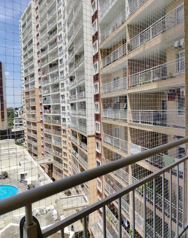 Balcony pigeon nets fixed in Vile Parle West high rise apartment