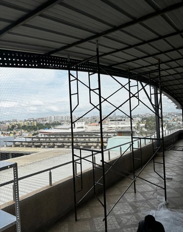 Close-up of a sturdy pigeon net tightly secured on a Vasai balcony.