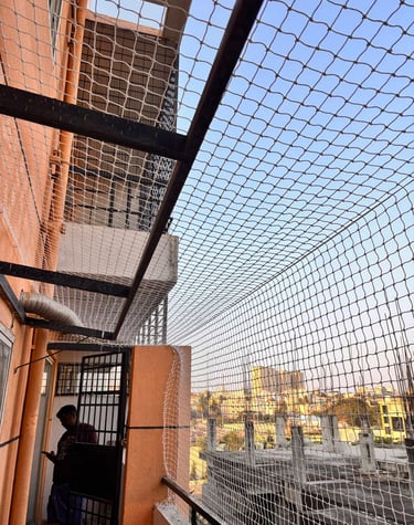 Anti pigeon net installation for residential balcony in Vile Parle West