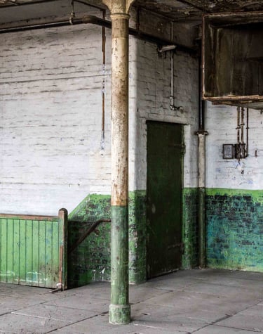 Industrial peeling paint, Stone floor, old metal door in the Stone room at Atlas Studios