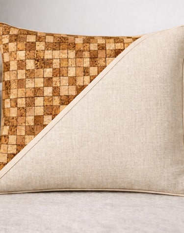 Modern decorative throw pillow with a dual-texture design of cork mosaic and cream linen fabric.