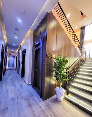 Bright and inviting hotel lobby with modern furniture and warm lighting.