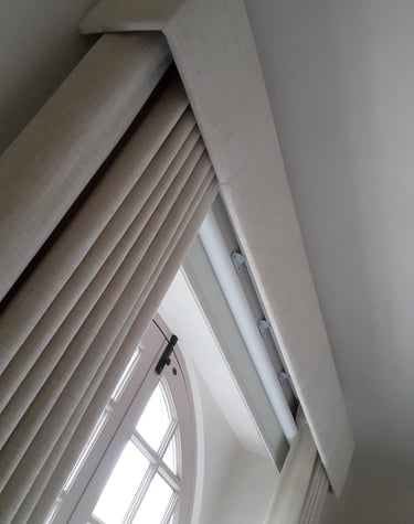 pair of curtains in a beautiful pelmet