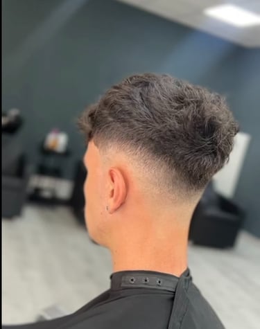 a man with a haircut and a haircut