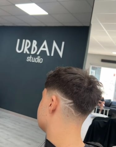 a man with a haircut and a haircut
