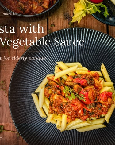 Soft penne pasta with hidden vegetable sauce served on a dark plate, ideal as easy meals for elderly parents.