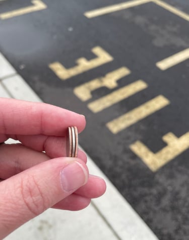 a person holding a ring with a ring on it