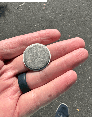 a person holding a coin with a coin