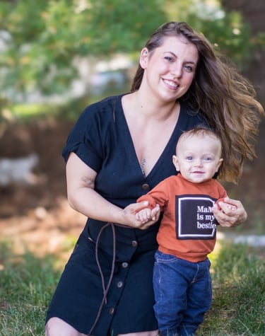 a woman holding a child in her arms