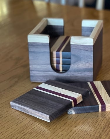 Handcrafted coaster set made from black walnut, maple and purple. heart.