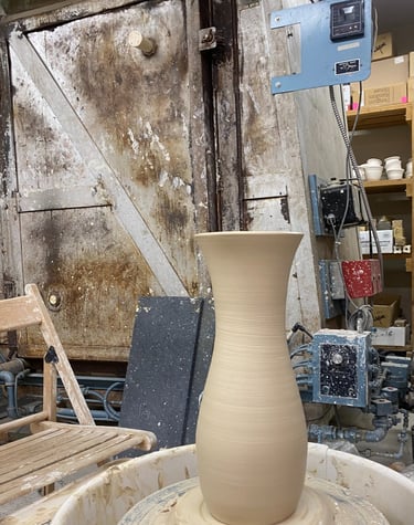 A large clay vase thrown on the wheel by Ben Trammell at AV Clay Creations