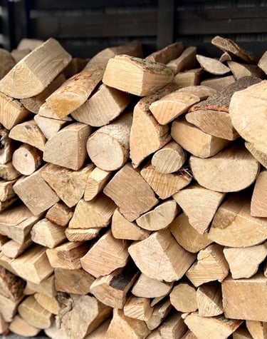 Premium kiln dried logs stacked in a log store
