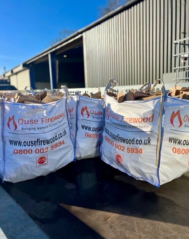 Kiln dried hardwood logs in 0.65m3 dumpy bags with Ouse Firewood branding in Cambridgeshire